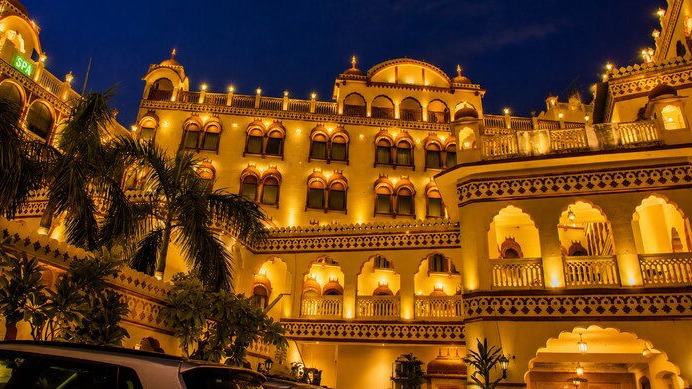 Fort Chandragupt Hotel illuminated facade at night, Jaipur