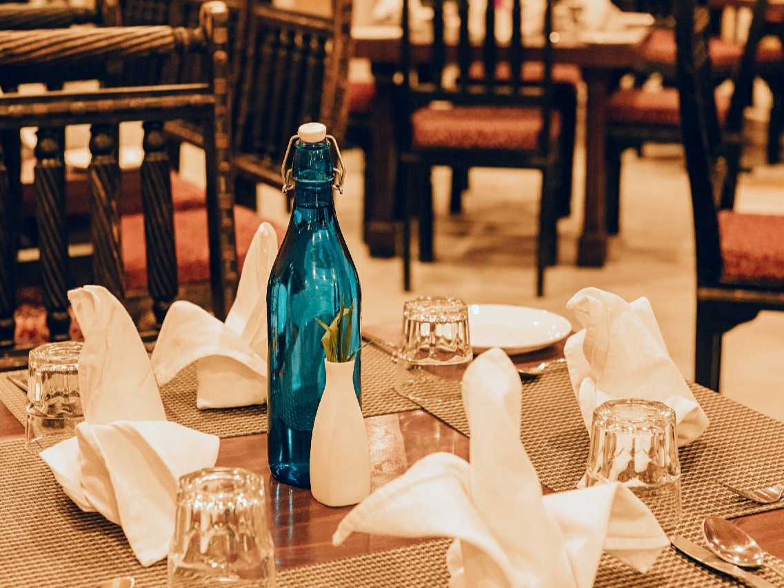 Saqi lounge bar interior with a well-stocked bar counter at Fort Chandragupt Hotel Jaipur